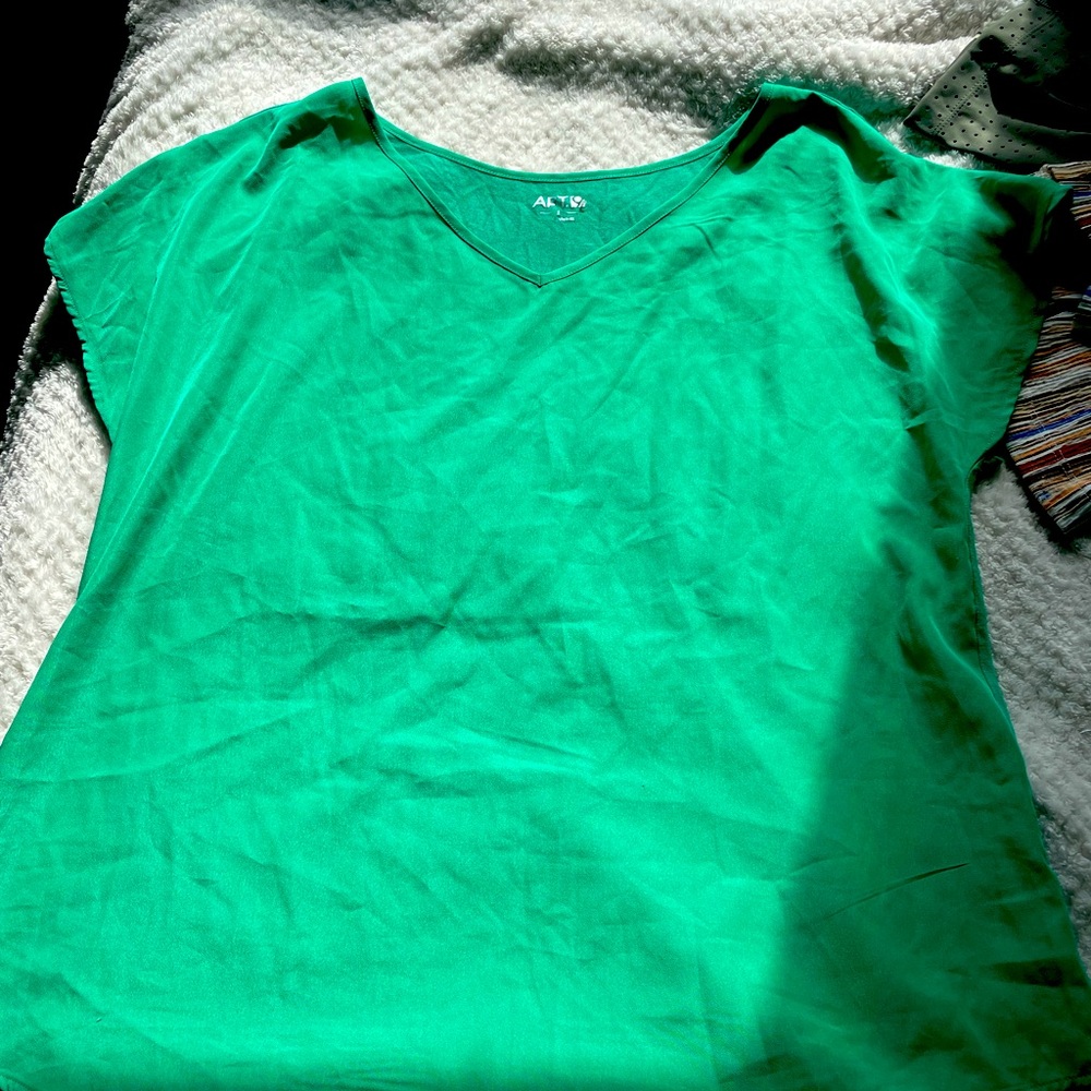 Bright green short sleeve blouse.